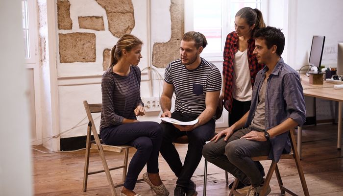Business team looking at pie chart