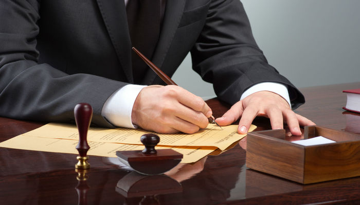 Businessman signing a document