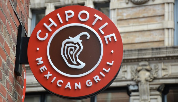 Chipotle Mexican Grill signboard on the wall in Boston.