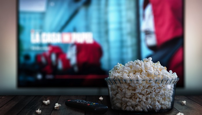 Bowl of popcorn in front of a television screen showing La Casa De Papel