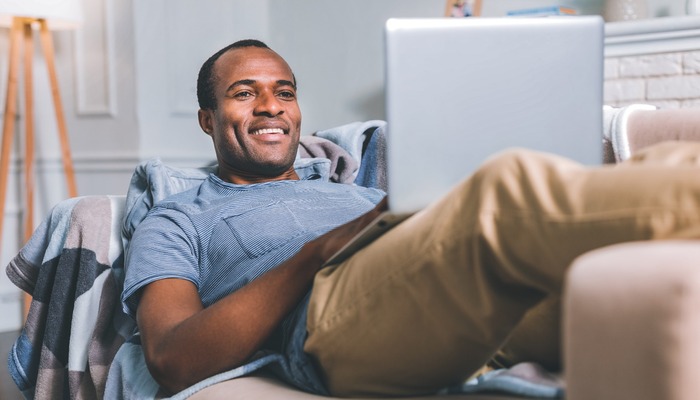 Gen X consumer browsing on his laptop