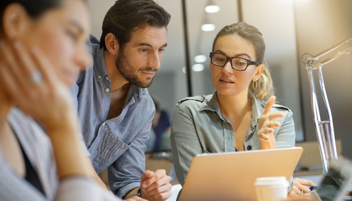 Two marketers consulting with each other