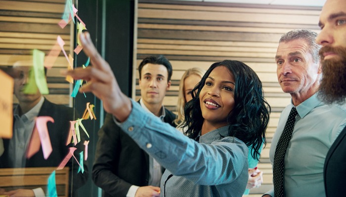 Female boss leading brainstorming session