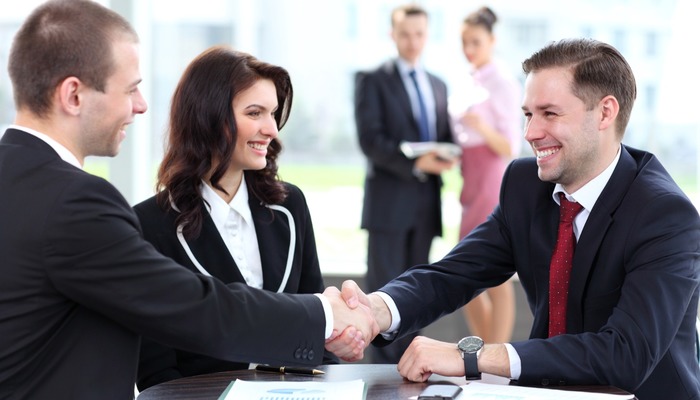 Bank manager meeting with corporate clients