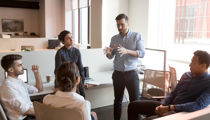 Business leader discussing with his staff