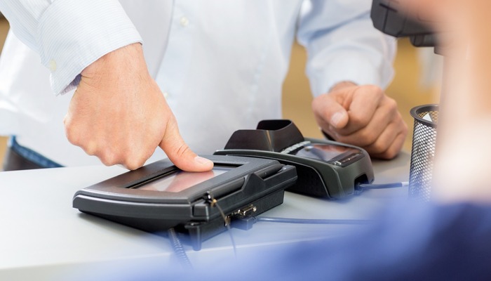 Customer Giving Thumb Impression To Make Payment