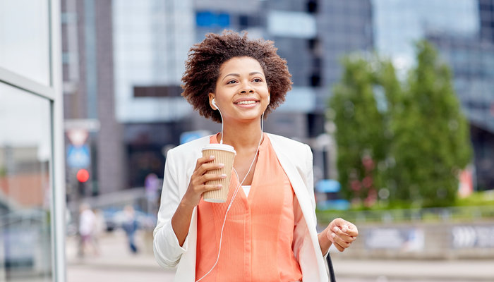 Entrepreneur wearing headphones listening to podcast